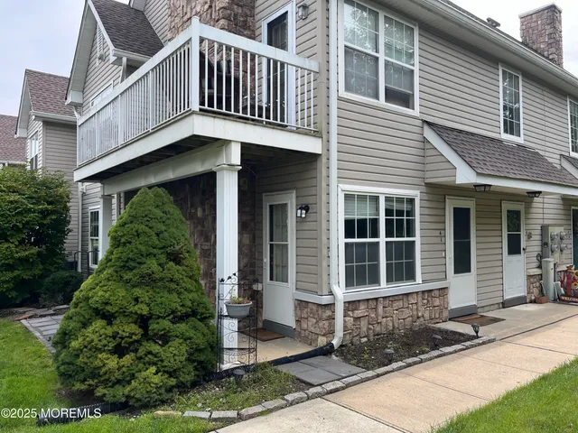 a blue white house with outdoor space