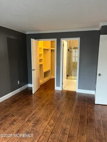 a view of an empty room with glass door
