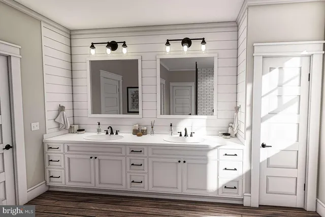a bathroom with a double vanity sink mirror and