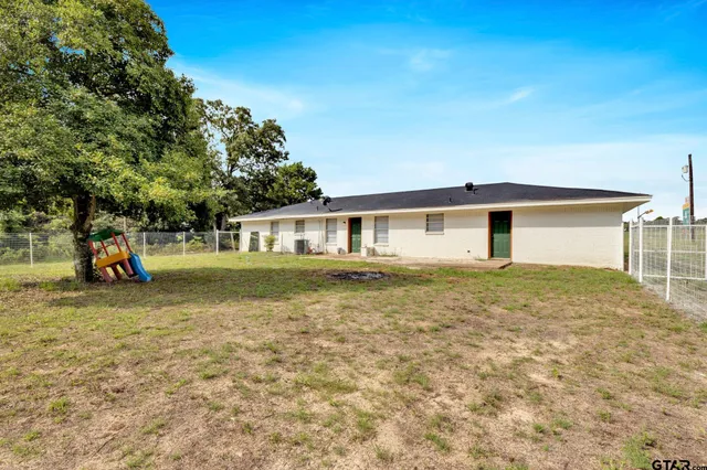 a view of a backyard of a house