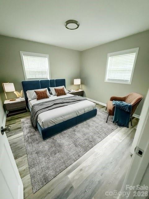 436 Clinton Avenue Lancaster, SC 29720 - Photo 6 of 11 a bedroom with a bed and a couch