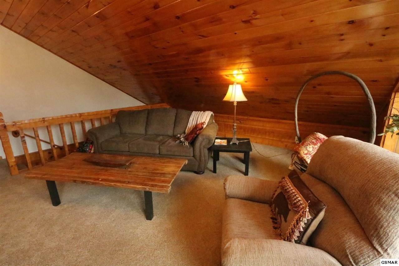 352 Warrior Ridge Way Cosby, TN 37722 - Photo 11 of 23 a reading room with furniture and wooden floor