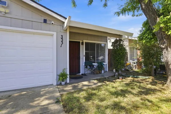 front view of a house with a yard