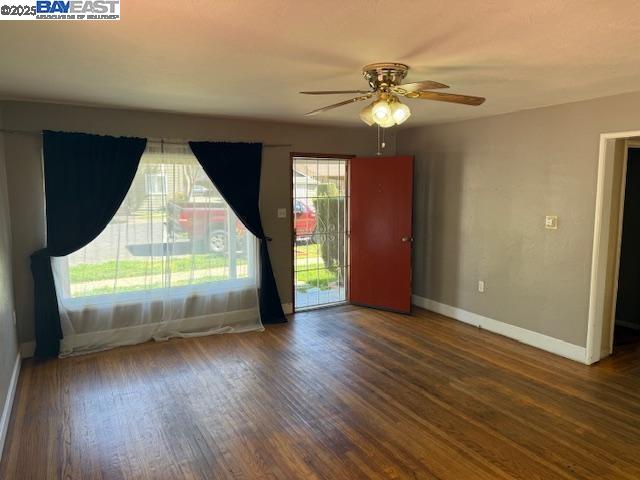 466 Rose Avenue Pleasanton, CA 94566 - Photo 2 of 4 an empty room with wooden floor and windows