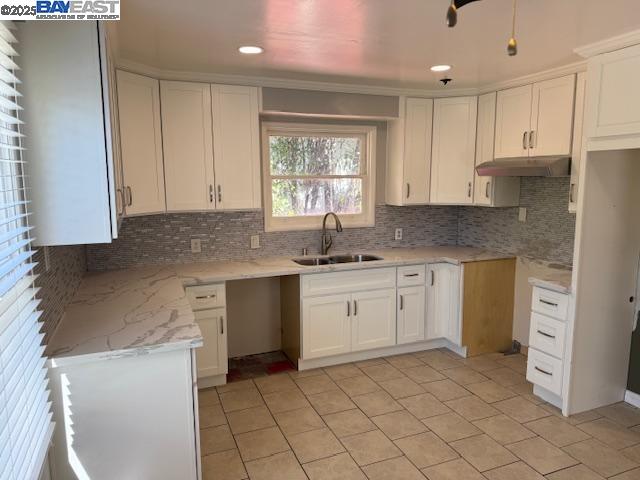 466 Rose Avenue Pleasanton, CA 94566 - Photo 3 of 4 a kitchen with a sink window and cabinets