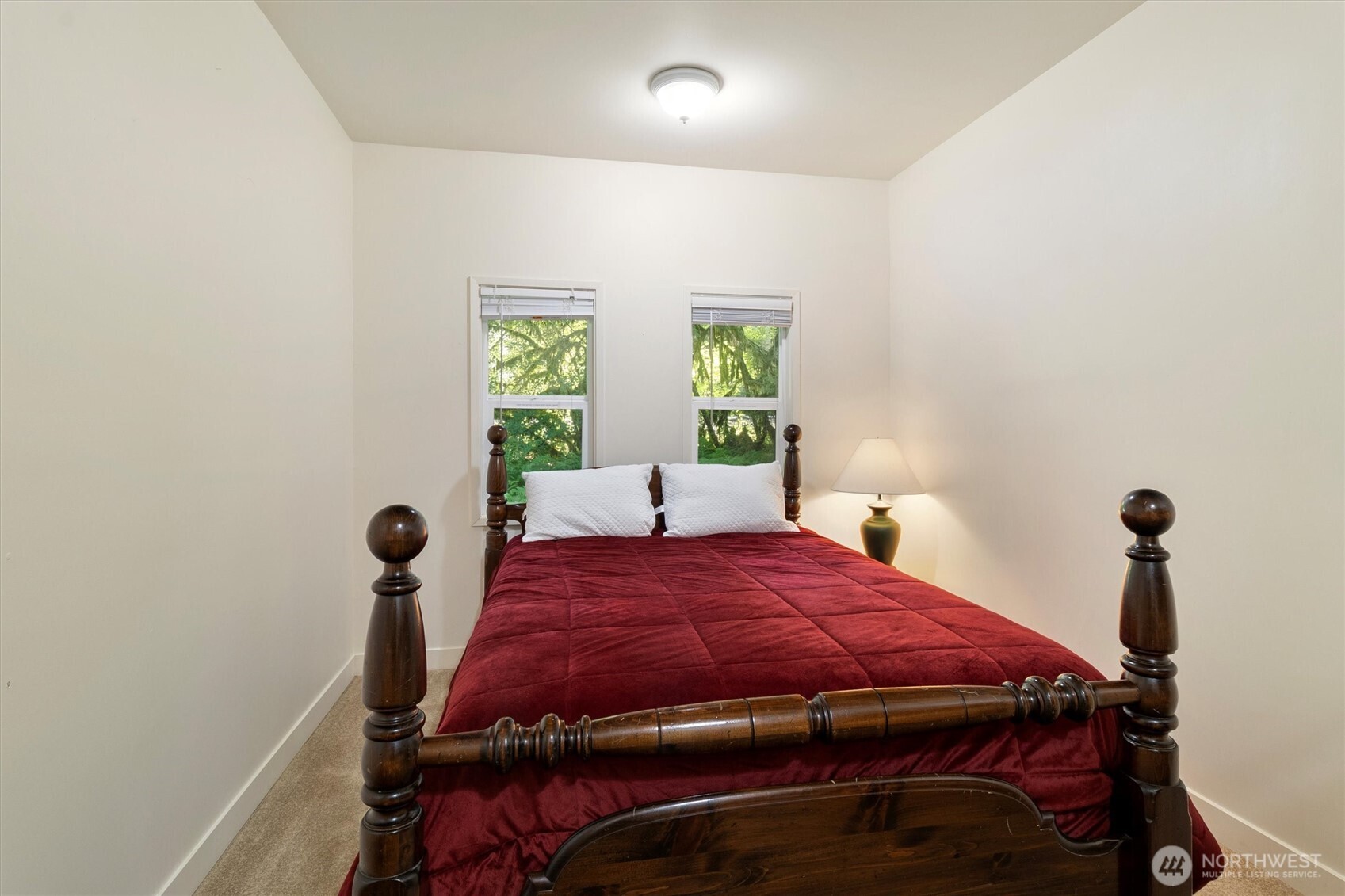 7036 Rainier Way Glacier, WA 98244 - Photo 20 of 39 a bed sitting in a bedroom next to a window