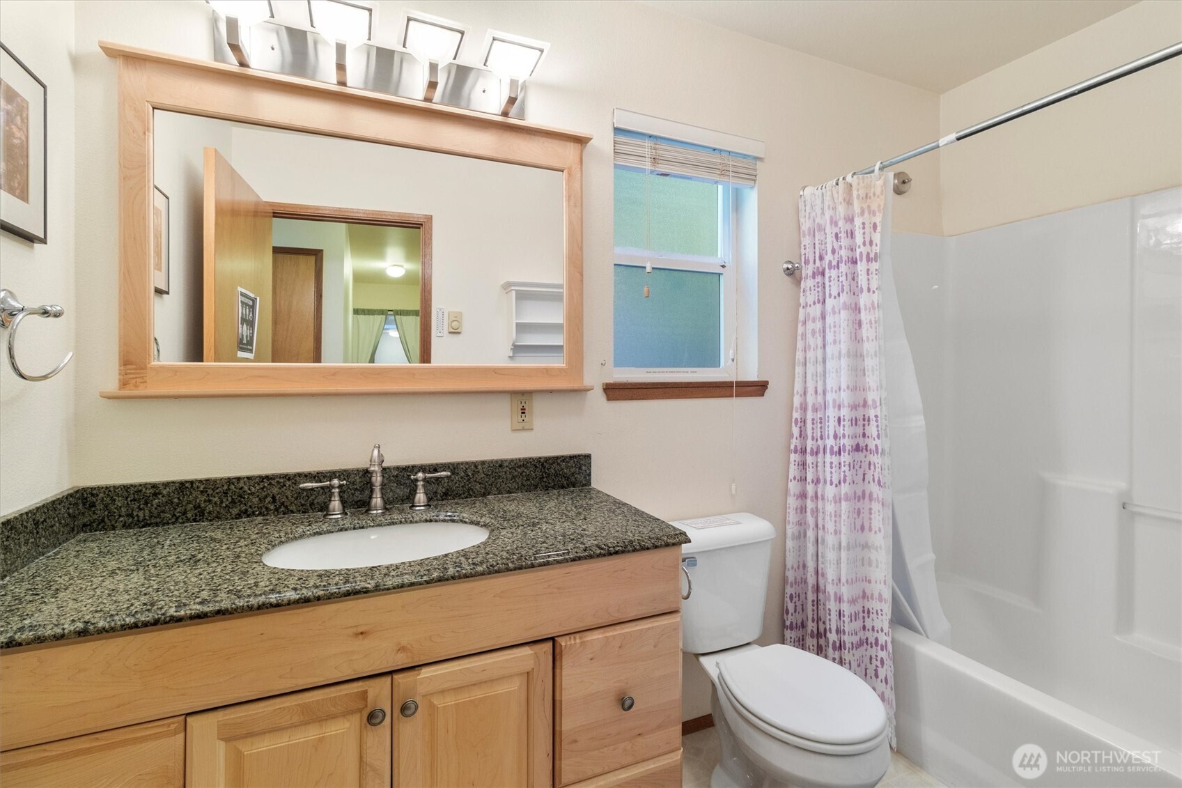 7036 Rainier Way Glacier, WA 98244 - Photo 23 of 39 a bathroom with a granite countertop sink toilet mirror and shower