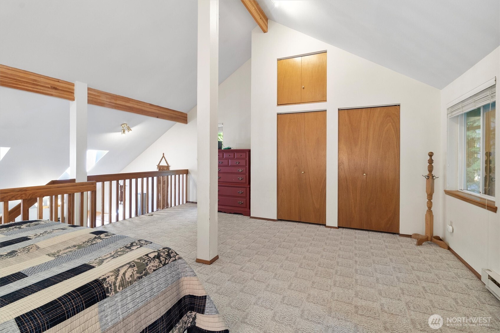 7036 Rainier Way Glacier, WA 98244 - Photo 25 of 39 a view of a bedroom with wooden floor and windows