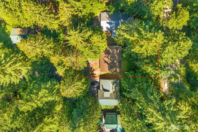 a view of a house with a tree