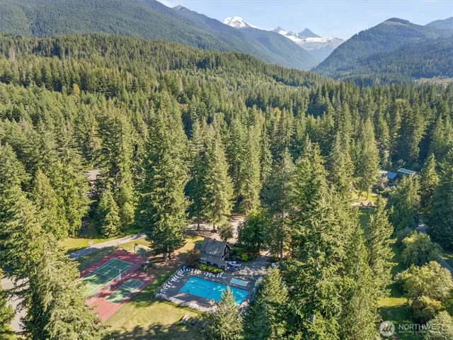 swimming pool view with a sitting space