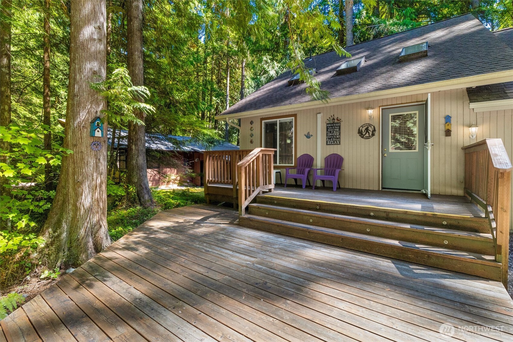 7036 Rainier Way Glacier, WA 98244 - Photo 4 of 39 a view of house with backyard and outdoor seating