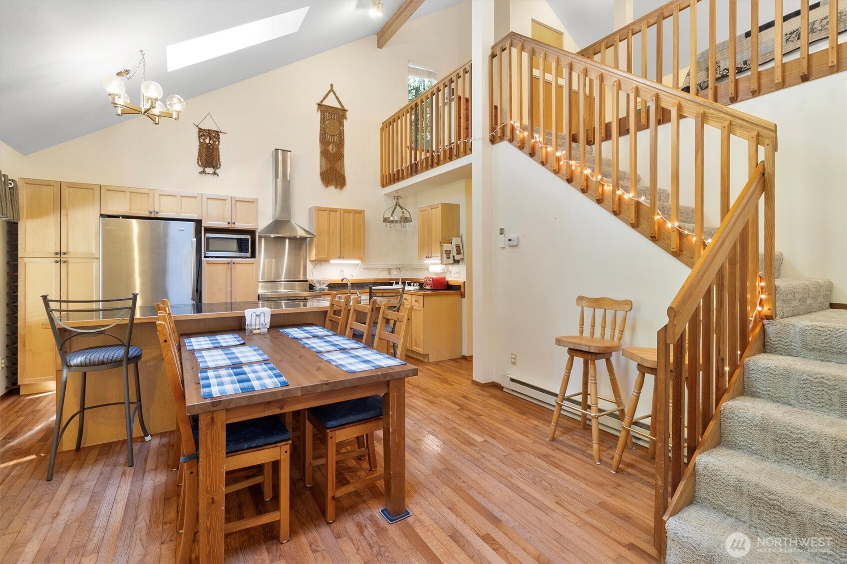 7036 Rainier Way Glacier, WA 98244 - Photo 7 of 39 a view of a dining room with furniture and wooden floor