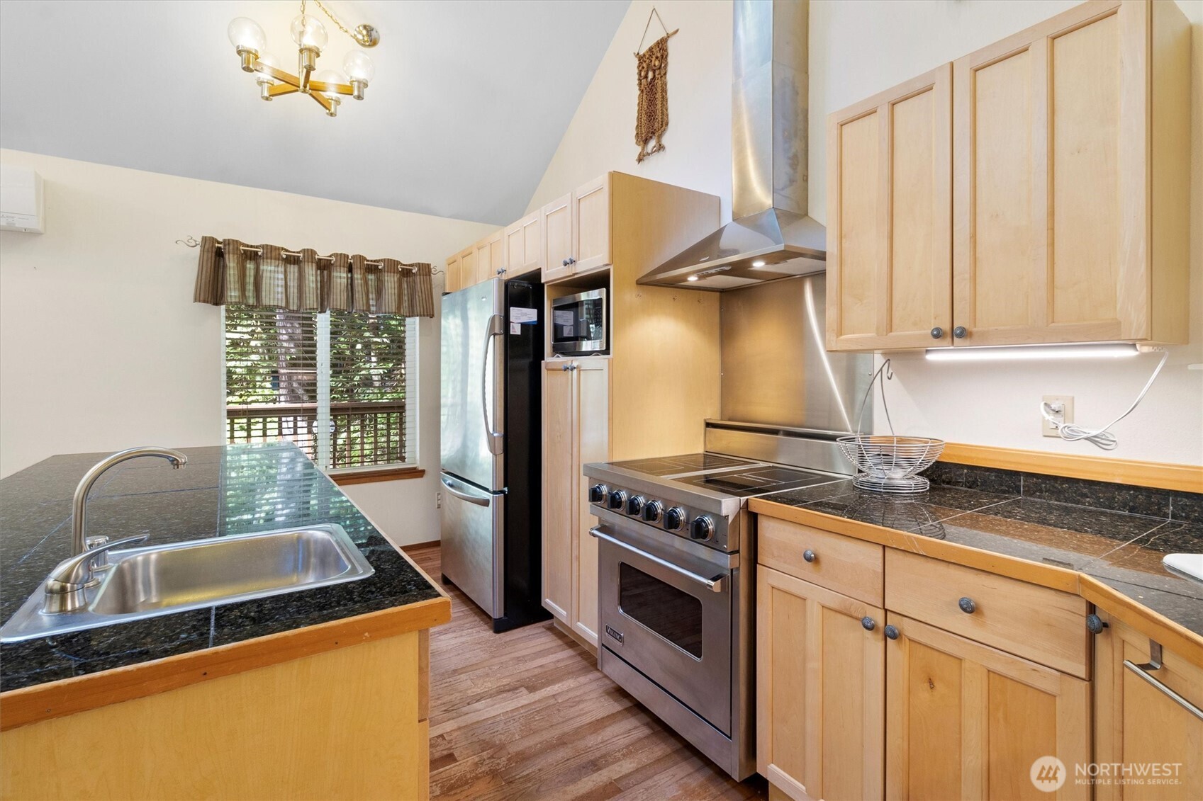 7036 Rainier Way Glacier, WA 98244 - Photo 10 of 39 a kitchen with stainless steel appliances granite countertop a stove a sink and a refrigerator