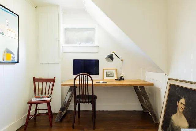 a view of dining room with furniture and wooden floor