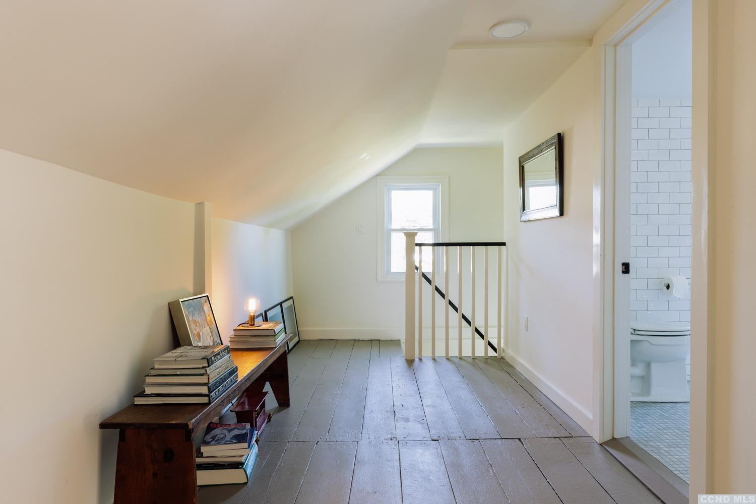 85 Roundtop Road Germantown, NY 12526 - Photo 26 of 31 a view of an empty room with wooden floor and stairs