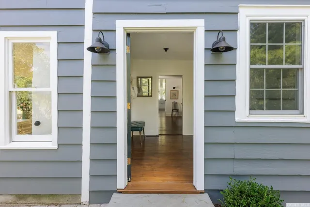 a view of front door with wooden door
