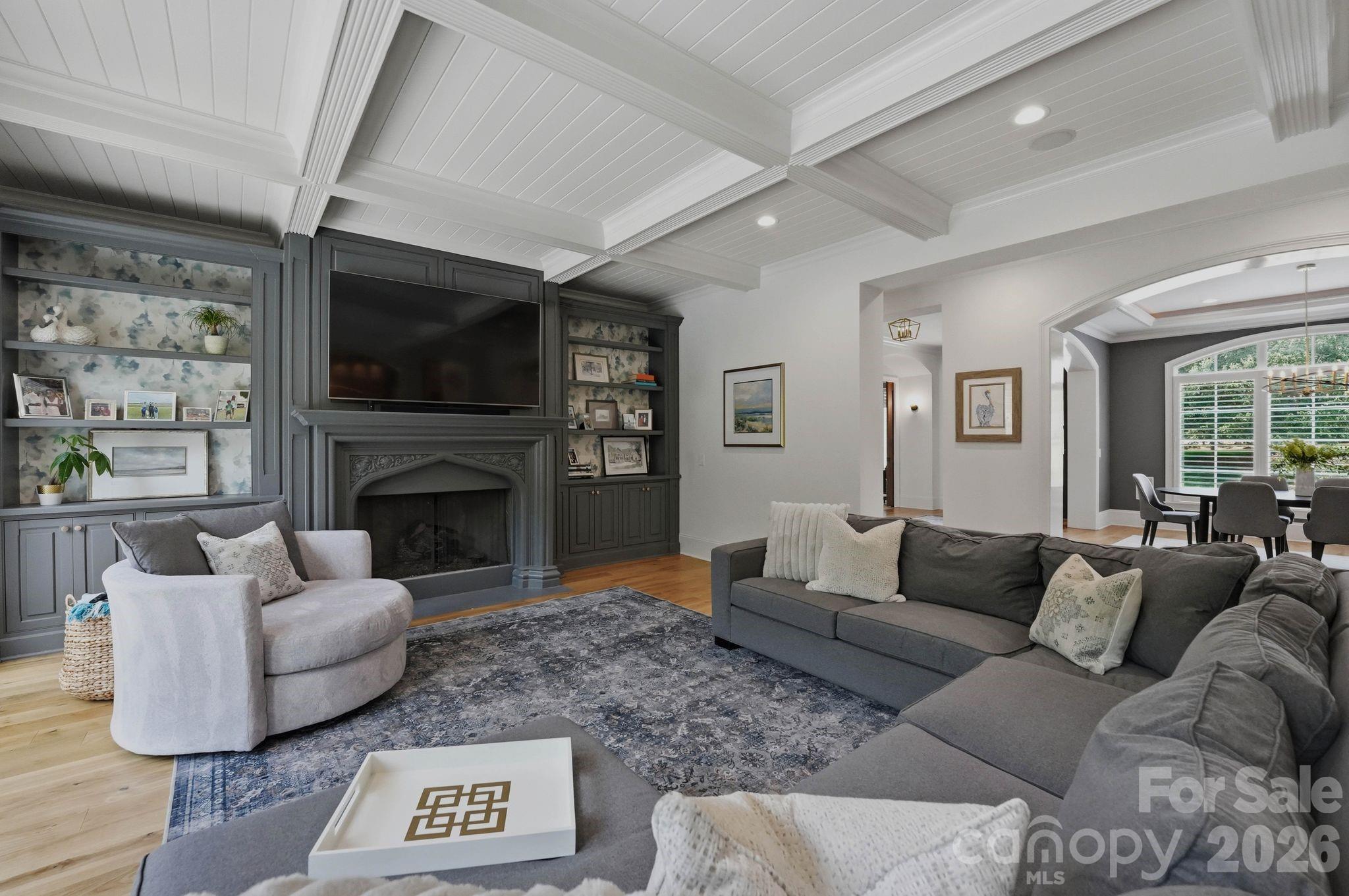 7416 Lee Rea Road Charlotte, NC 28226 - Photo 24 of 48 a living room with furniture a flat screen tv and a fireplace
