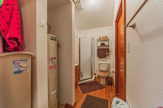 a bathroom with a toilet and a shower