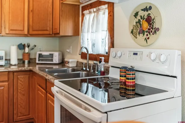 a kitchen with a stove and a sink