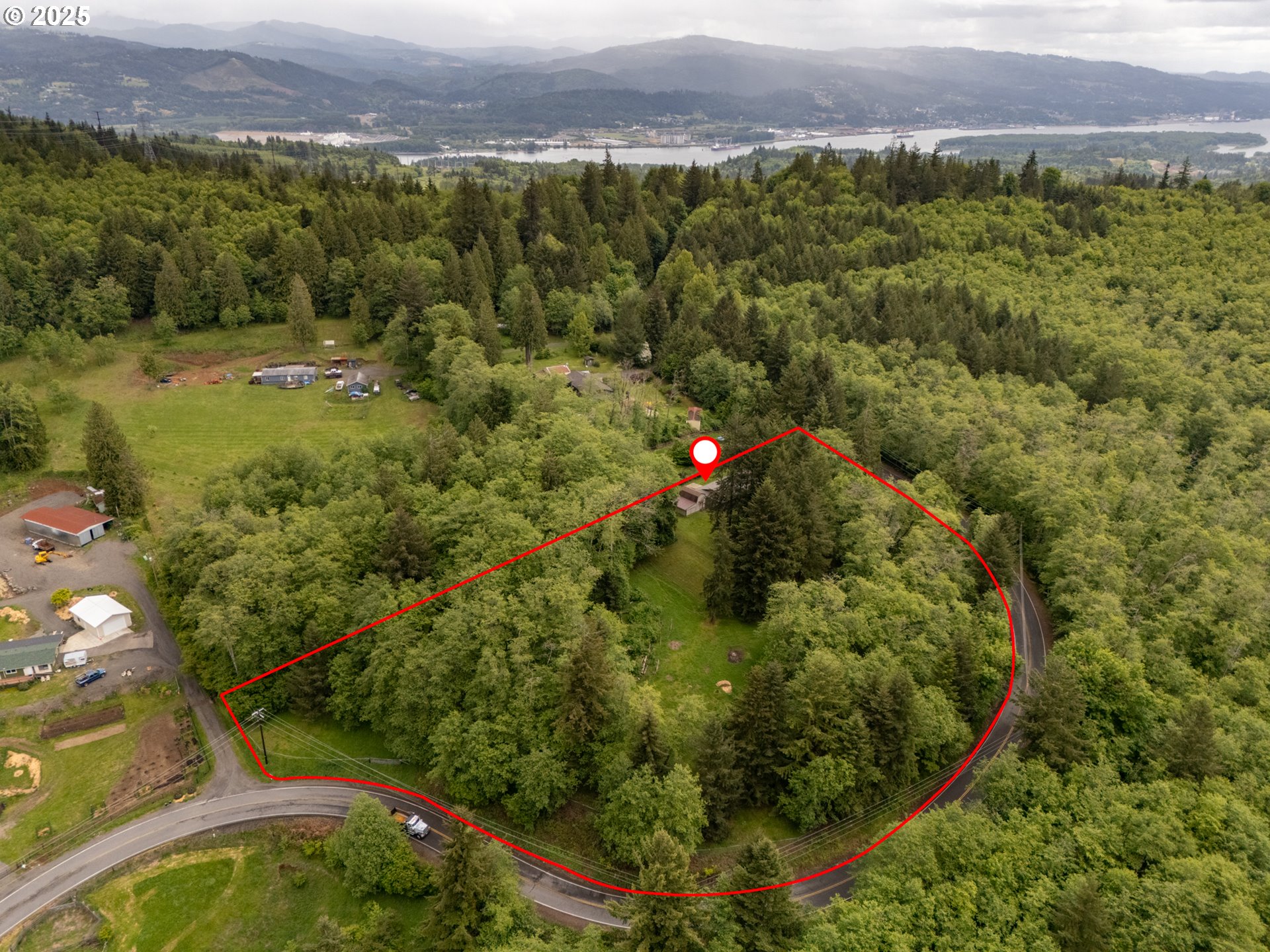 31052 Brownlee Road Rainier, OR 97048 - Photo 27 of 47 an aerial view of residential houses with outdoor space and trees