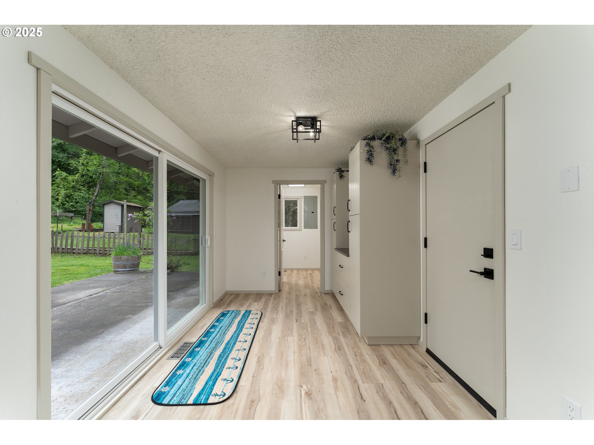 31052 Brownlee Road Rainier, OR 97048 - Photo 39 of 47 a view hallway with wooden floor and a bathroom view