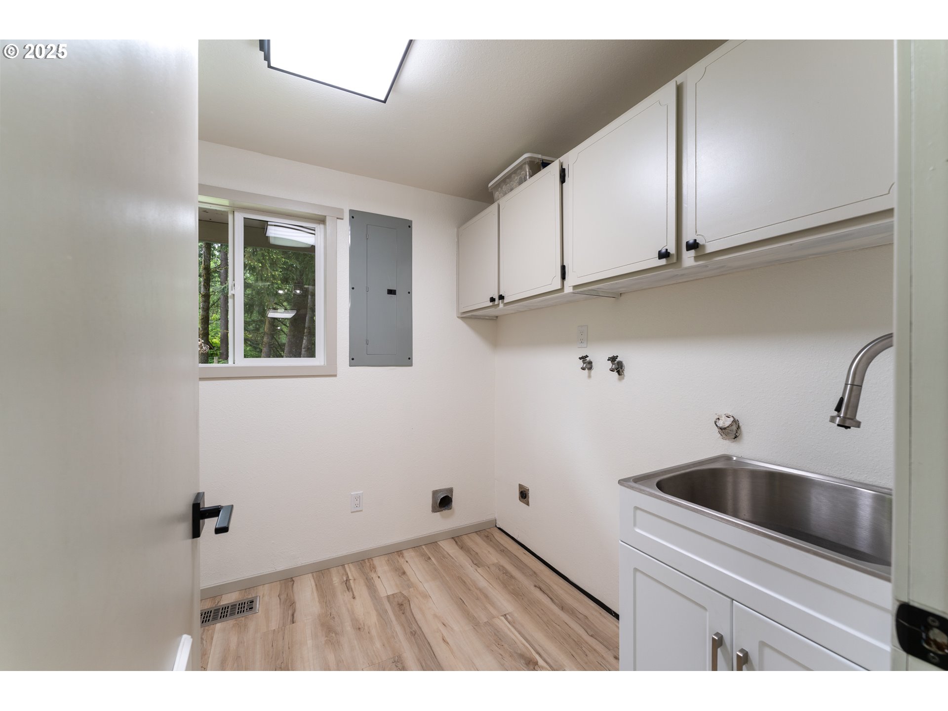 31052 Brownlee Road Rainier, OR 97048 - Photo 40 of 47 a kitchen view with wooden floor cabinets and a sink