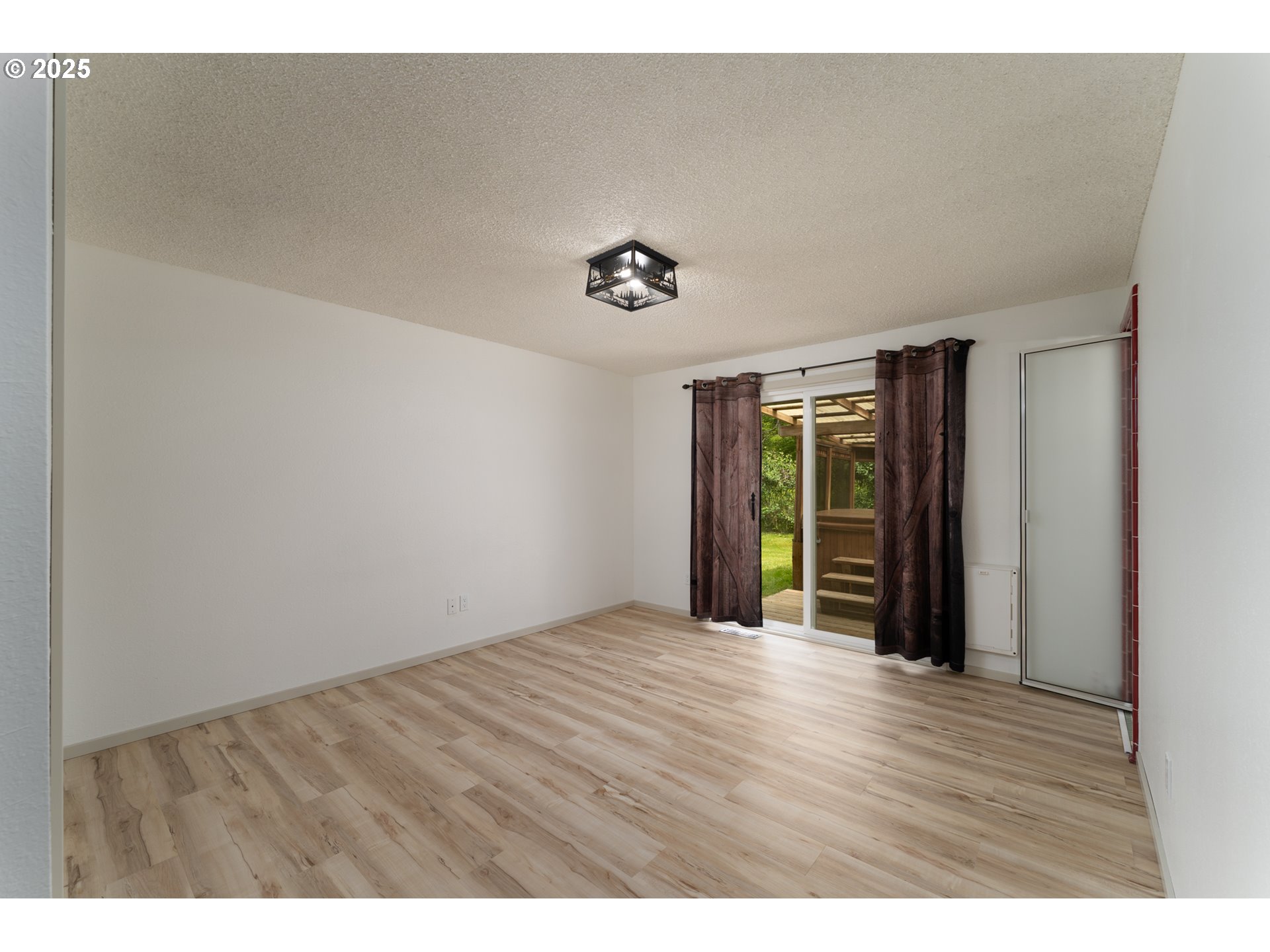 31052 Brownlee Road Rainier, OR 97048 - Photo 41 of 47 a view of an empty room with wooden floor