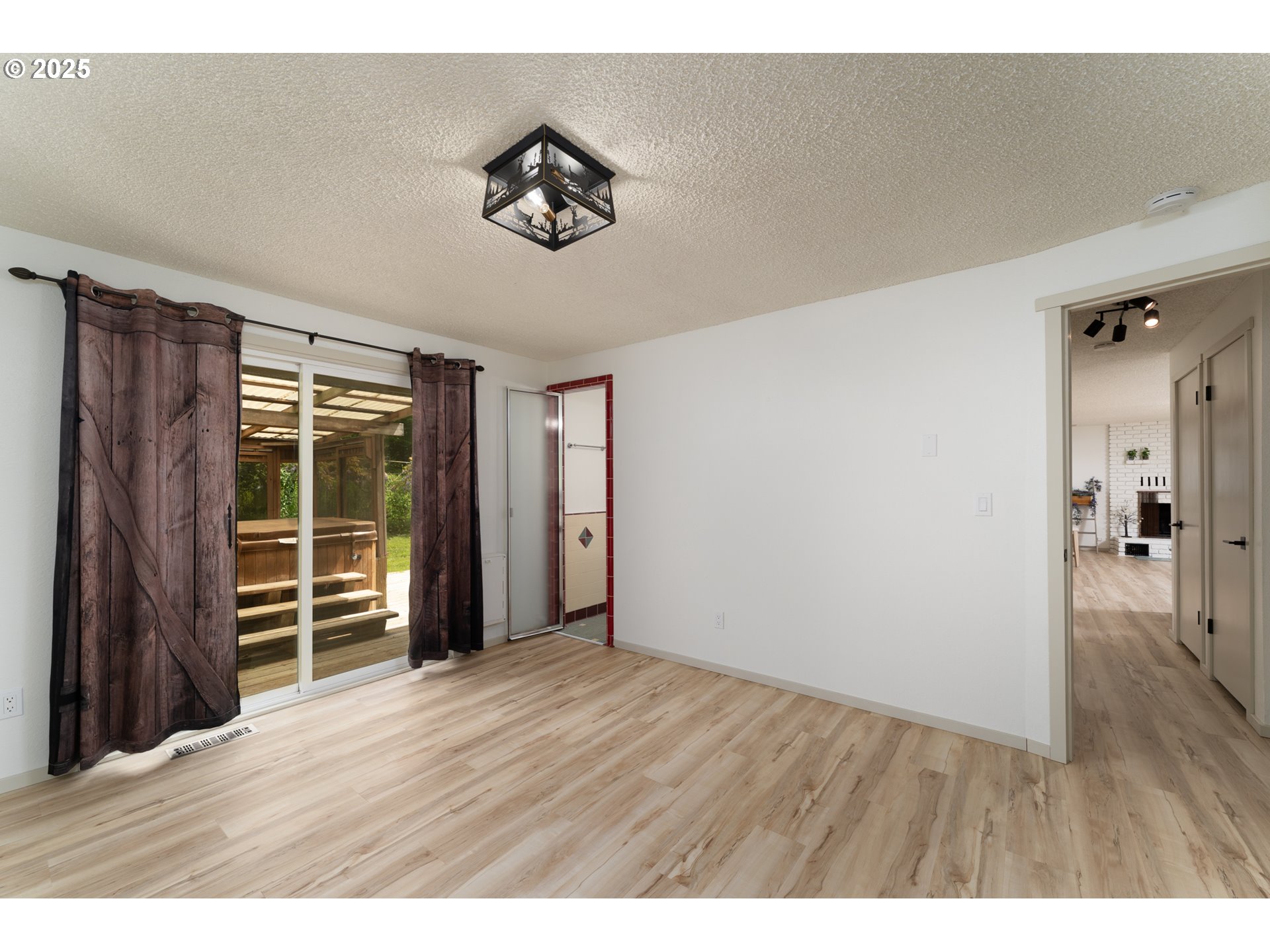 31052 Brownlee Road Rainier, OR 97048 - Photo 42 of 47 a view of an empty room with wooden floor and a window