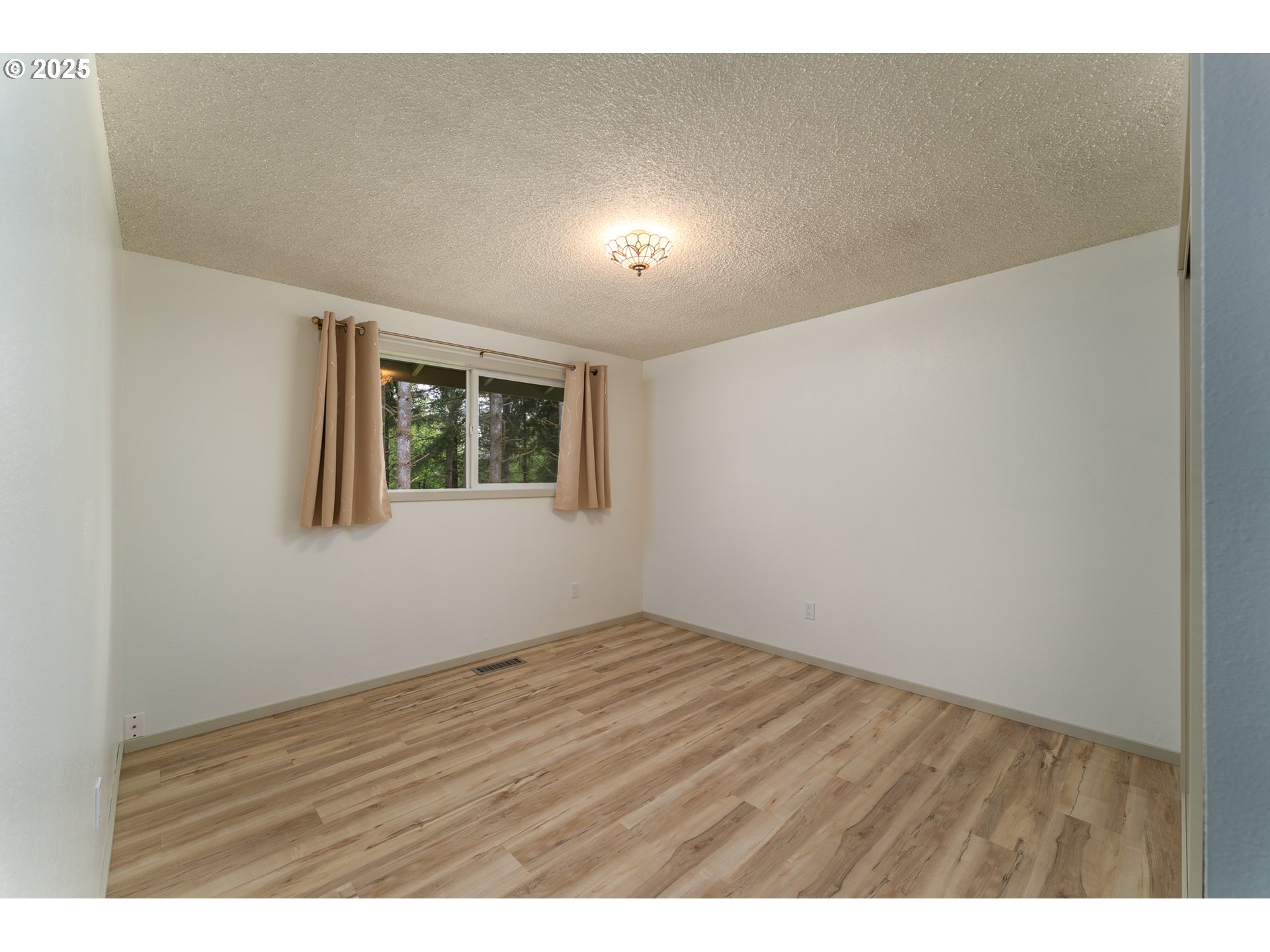 31052 Brownlee Road Rainier, OR 97048 - Photo 44 of 47 a view of an empty room with wooden floor