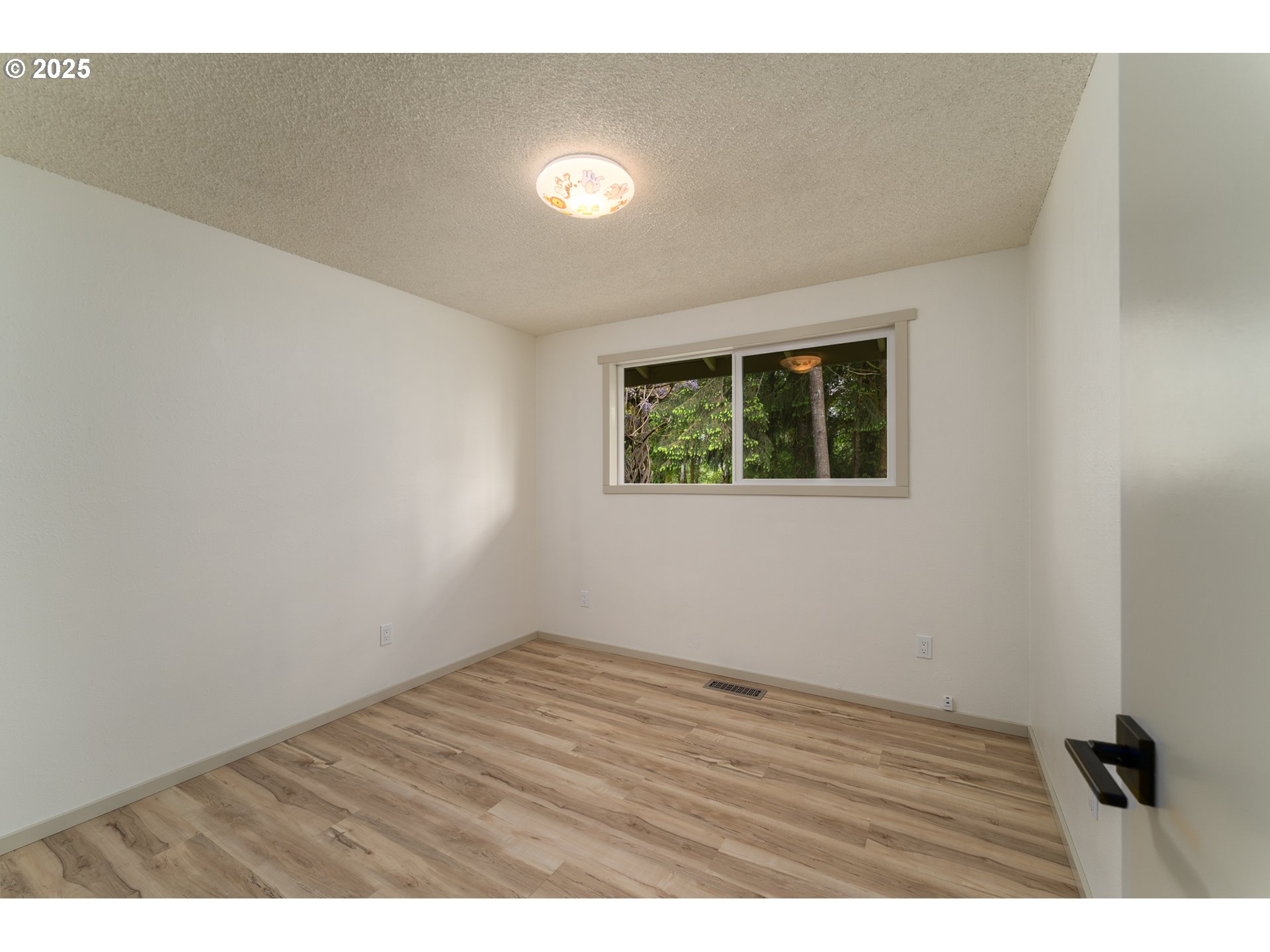 31052 Brownlee Road Rainier, OR 97048 - Photo 45 of 47 a view of an empty room with wooden floor and a window