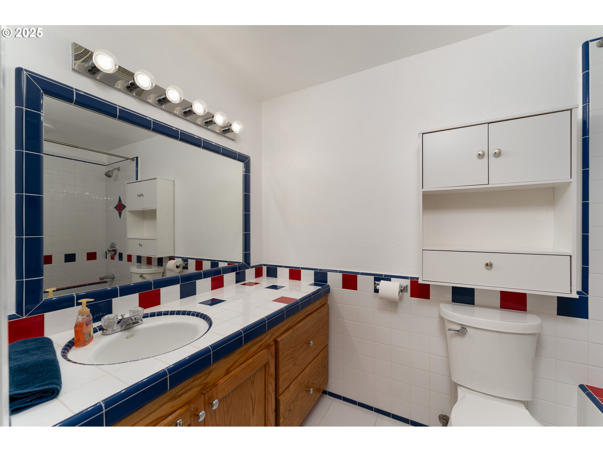 31052 Brownlee Road Rainier, OR 97048 - Photo 46 of 47 a bathroom with a sink vanity and mirror