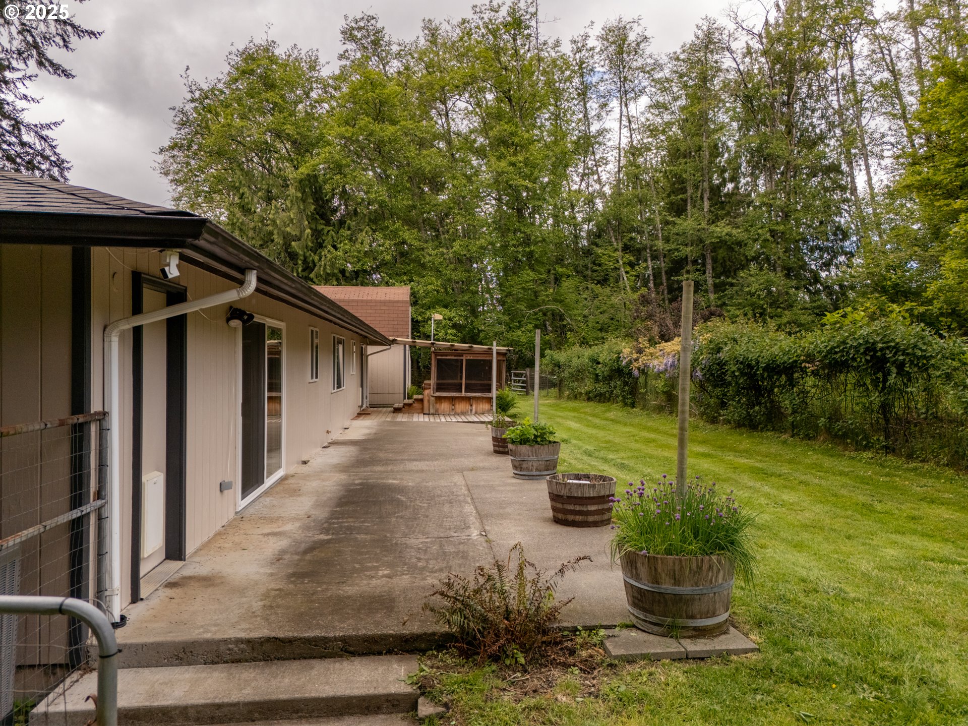 31052 Brownlee Road Rainier, OR 97048 - Photo 10 of 47 a view of a house with backyard and sitting area