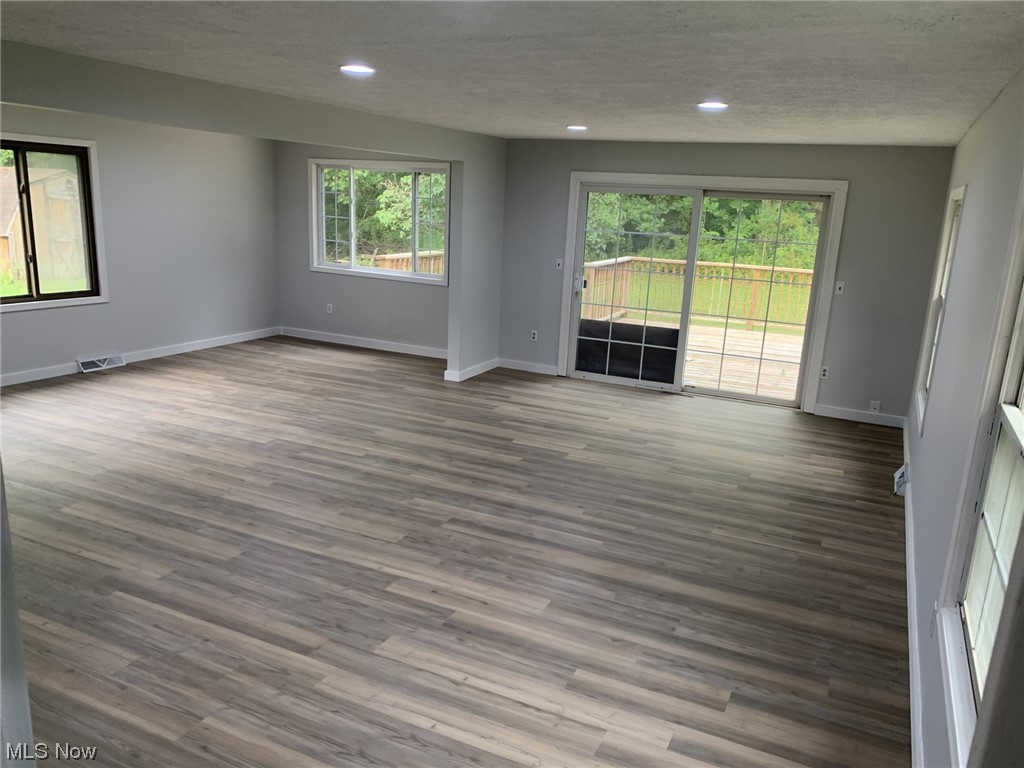 7618 Poore Road Conneaut, OH 44030 - Photo 8 of 18 Spare room with light hardwood floors