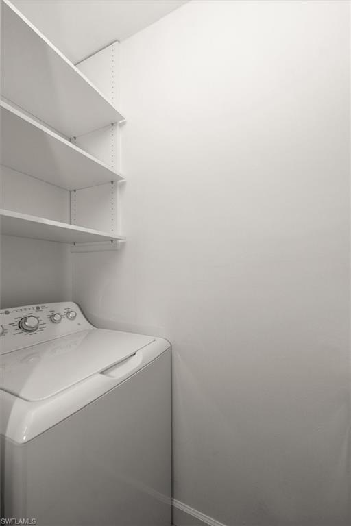 1170 Reserve Way, Unit 107 Naples, FL 34105 - Photo 15 of 47 Laundry room with washer / dryer