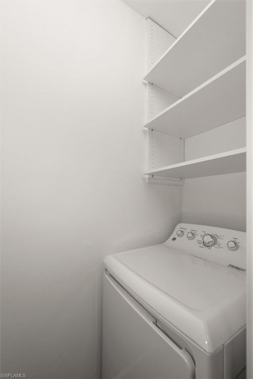 1170 Reserve Way, Unit 107 Naples, FL 34105 - Photo 16 of 47 Laundry room featuring washer / dryer