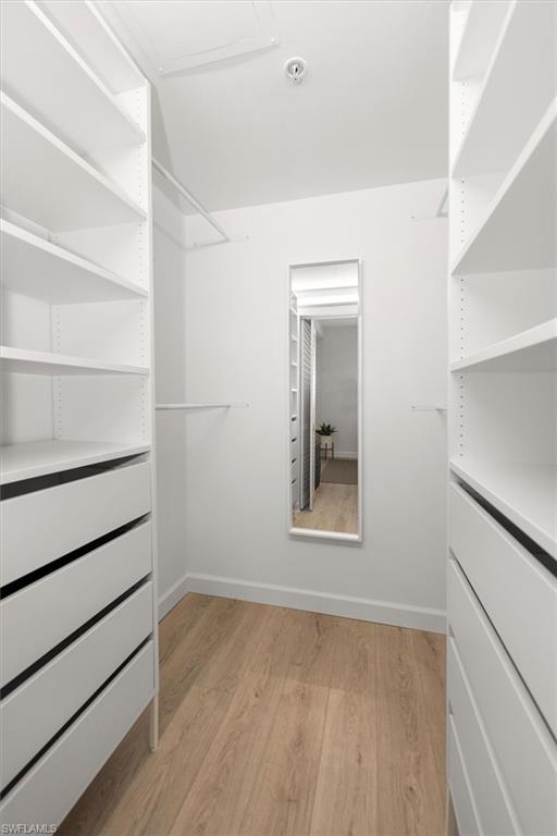 1170 Reserve Way, Unit 107 Naples, FL 34105 - Photo 21 of 47 Spacious closet featuring light wood-style floors
