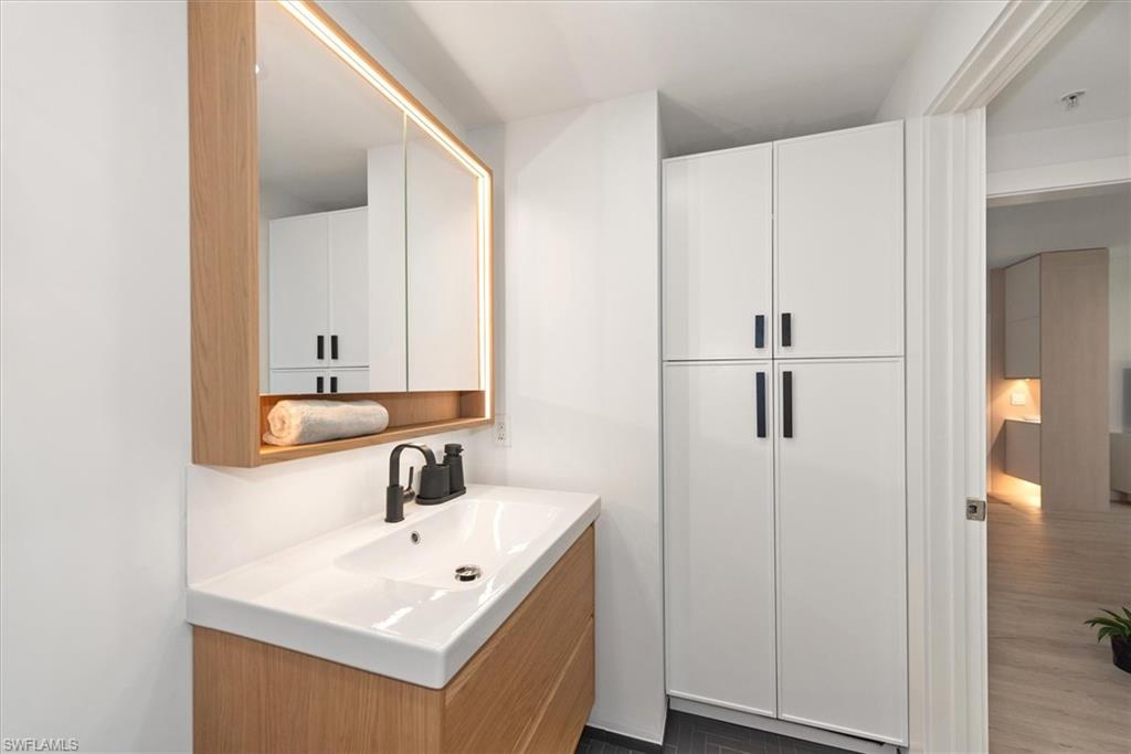 1170 Reserve Way, Unit 107 Naples, FL 34105 - Photo 23 of 47 Bathroom with vanity