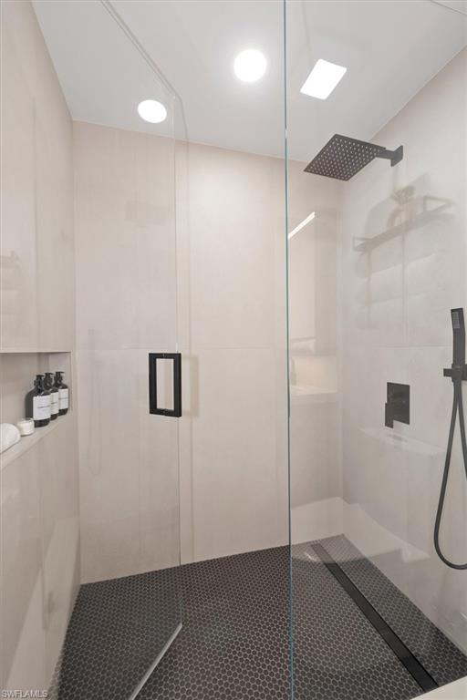1170 Reserve Way, Unit 107 Naples, FL 34105 - Photo 25 of 47 Bathroom with a stall shower