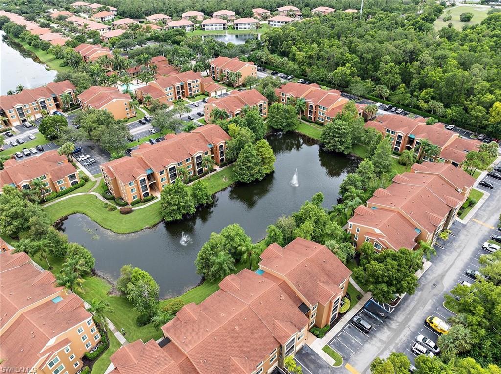 1170 Reserve Way, Unit 107 Naples, FL 34105 - Photo 29 of 47 Aerial view of a large body of water