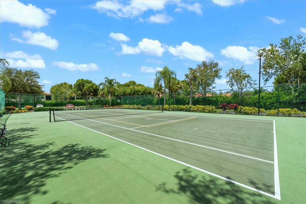 1170 Reserve Way, Unit 107 Naples, FL 34105 - Photo 39 of 47 View of tennis court featuring community basketball court
