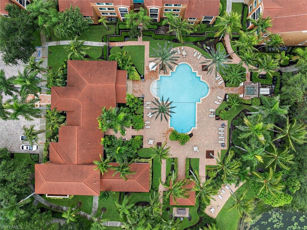 1170 Reserve Way, Unit 107 Naples, FL 34105 - Photo 41 of 47 Aerial view of a pool