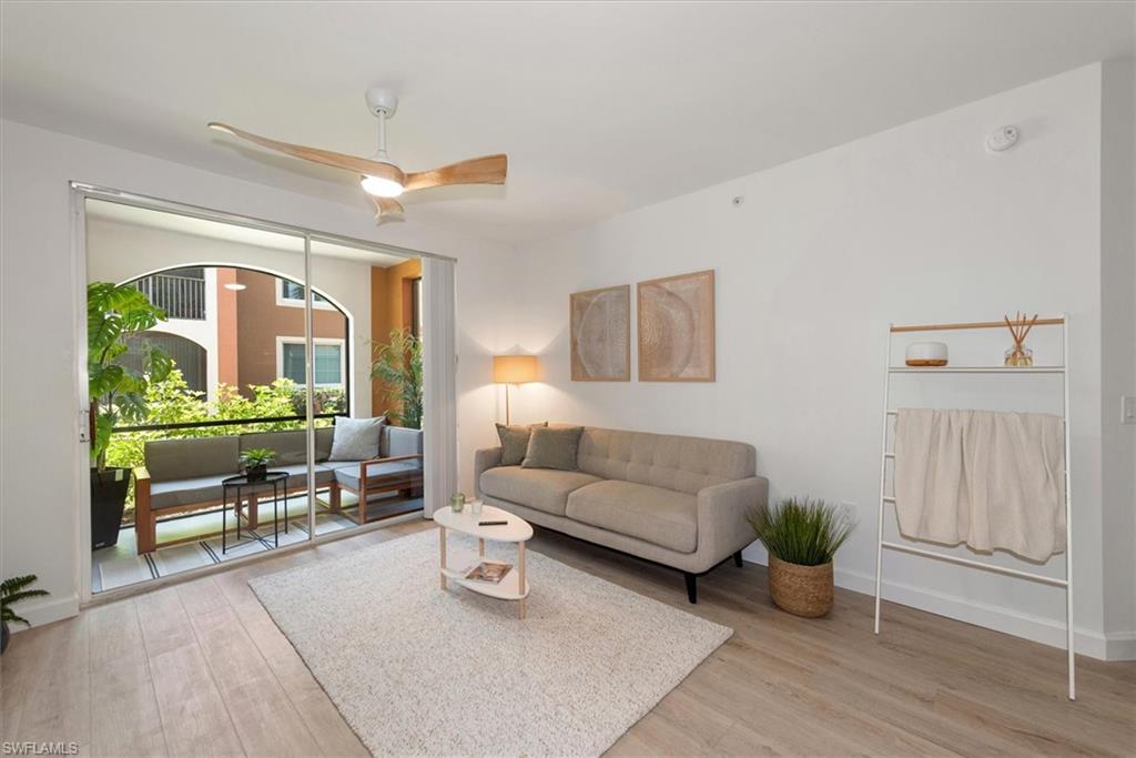 1170 Reserve Way, Unit 107 Naples, FL 34105 - Photo 6 of 47 Living area featuring light wood-type flooring and ceiling fan