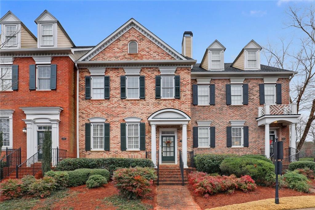 4712 Ivy Ridge Drive Southeast Atlanta, GA 30339 - Photo 1 of 1 a front view of a house with yard