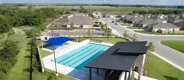 an aerial view of a house with a ocean view