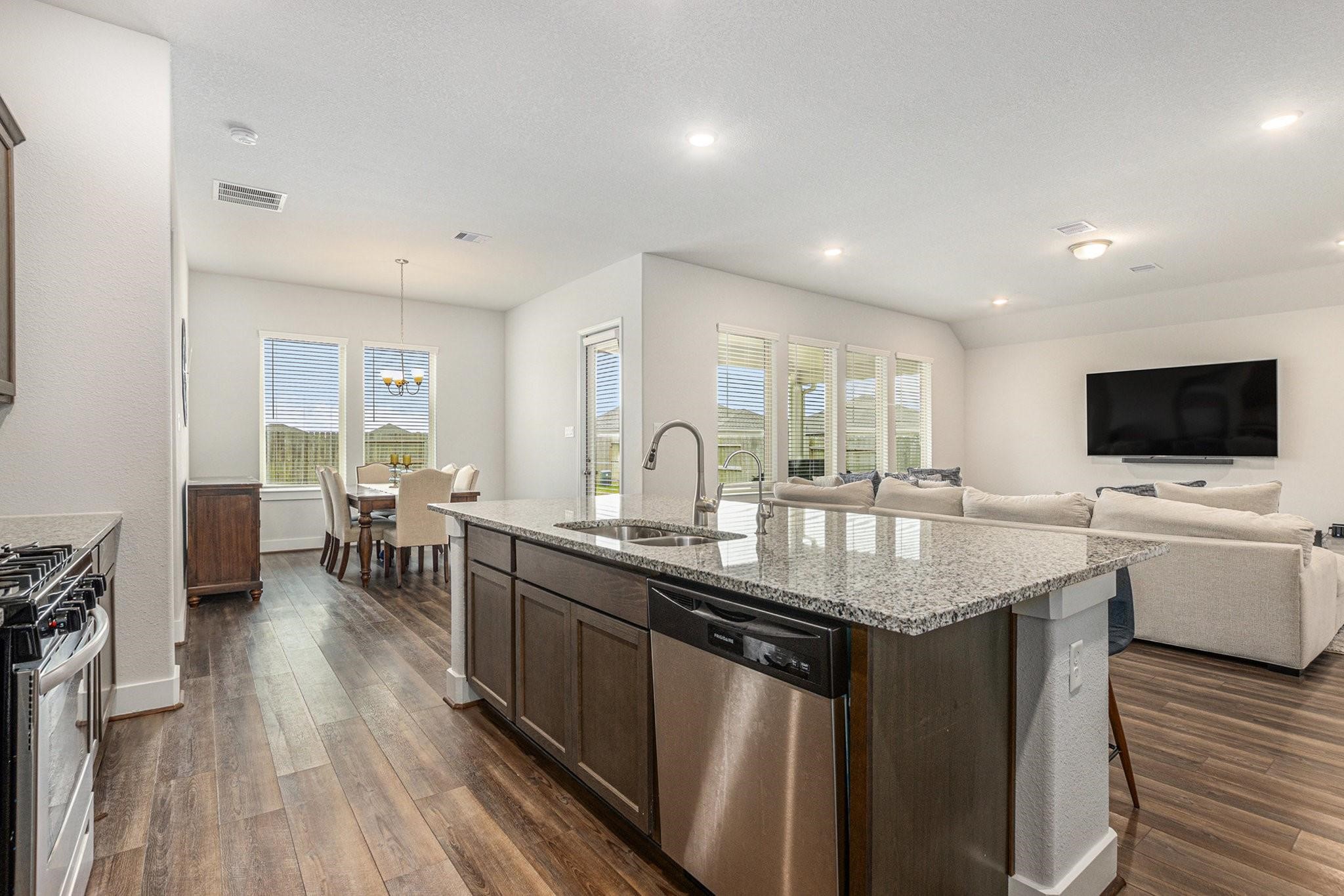 1818 Homewood Point Lane Rosharon, TX 77583 - Photo 11 of 41 a kitchen with sink and view of living room