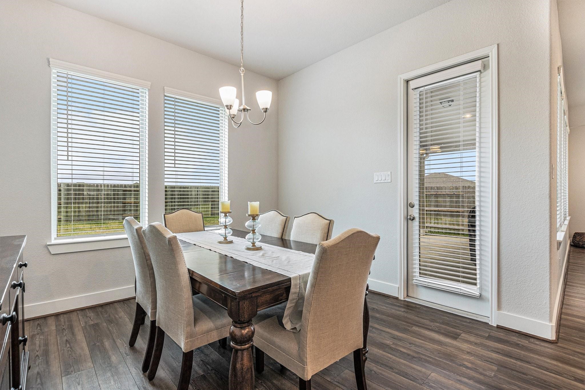 1818 Homewood Point Lane Rosharon, TX 77583 - Photo 14 of 41 a view of a dining room with furniture wooden floor and chandelier