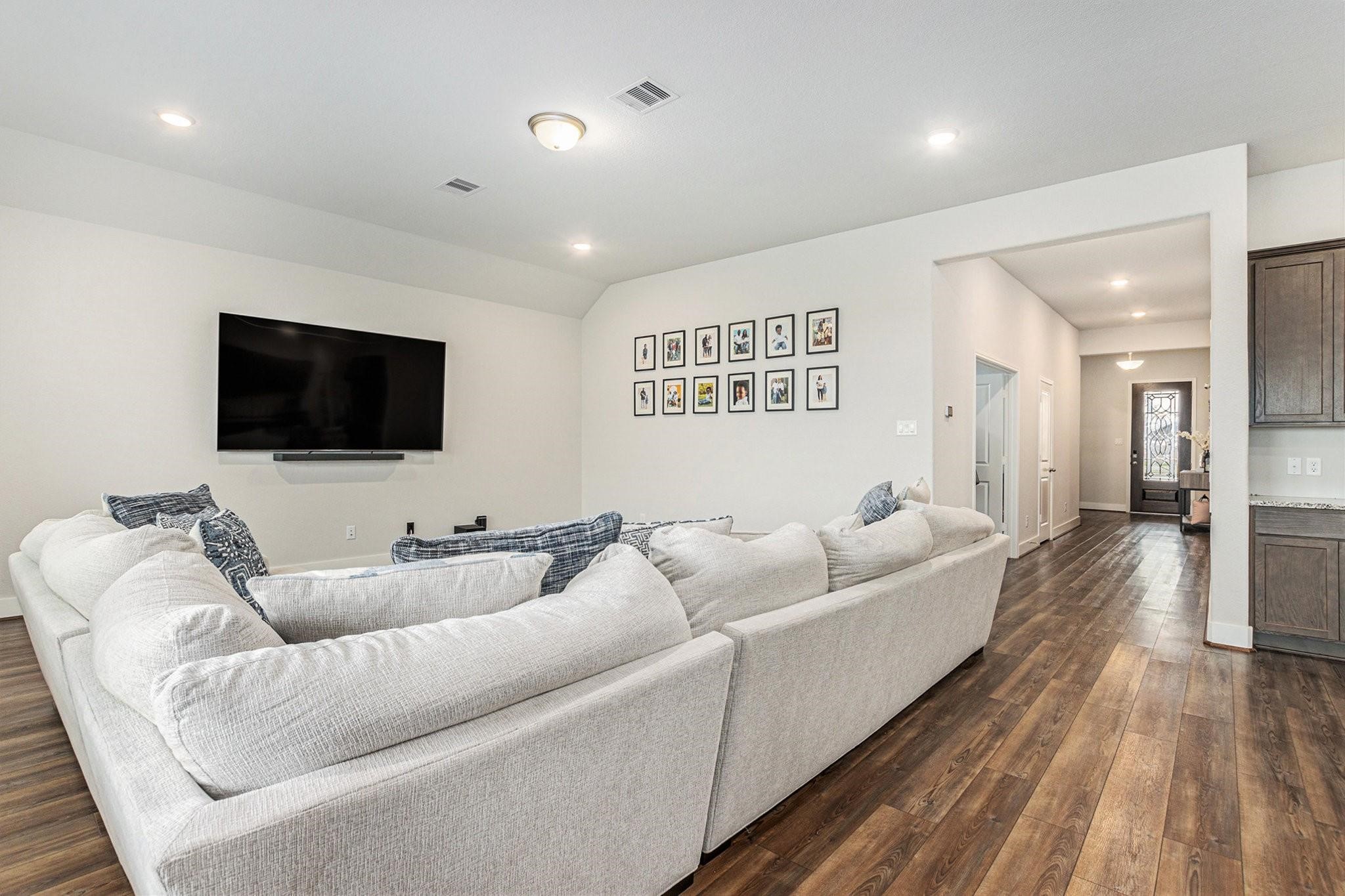 1818 Homewood Point Lane Rosharon, TX 77583 - Photo 15 of 41 a living room with furniture and a flat screen tv