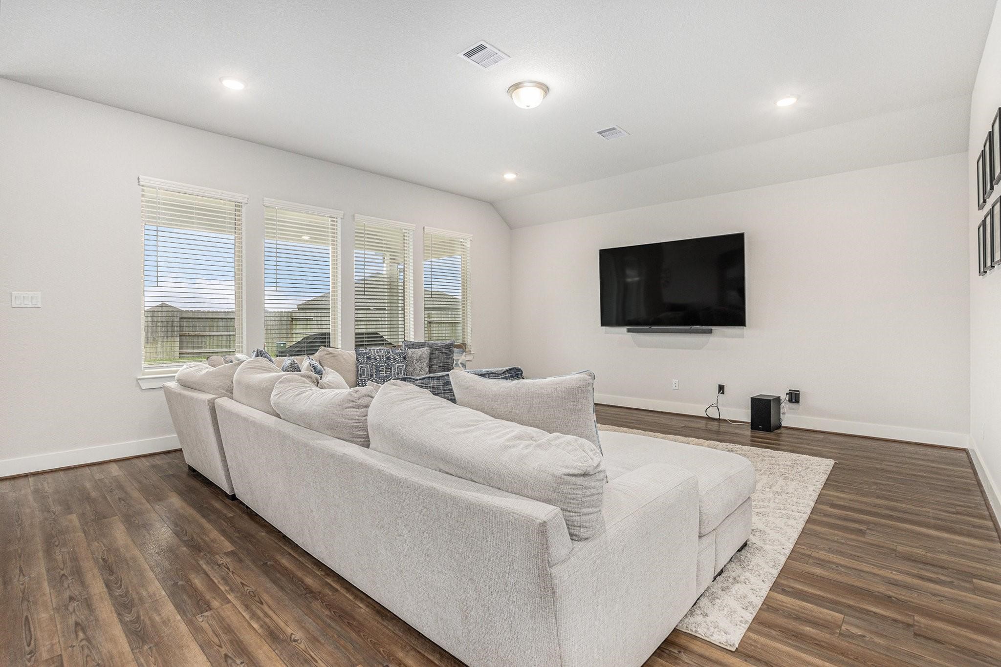 1818 Homewood Point Lane Rosharon, TX 77583 - Photo 16 of 41 a living room with furniture and a flat screen tv