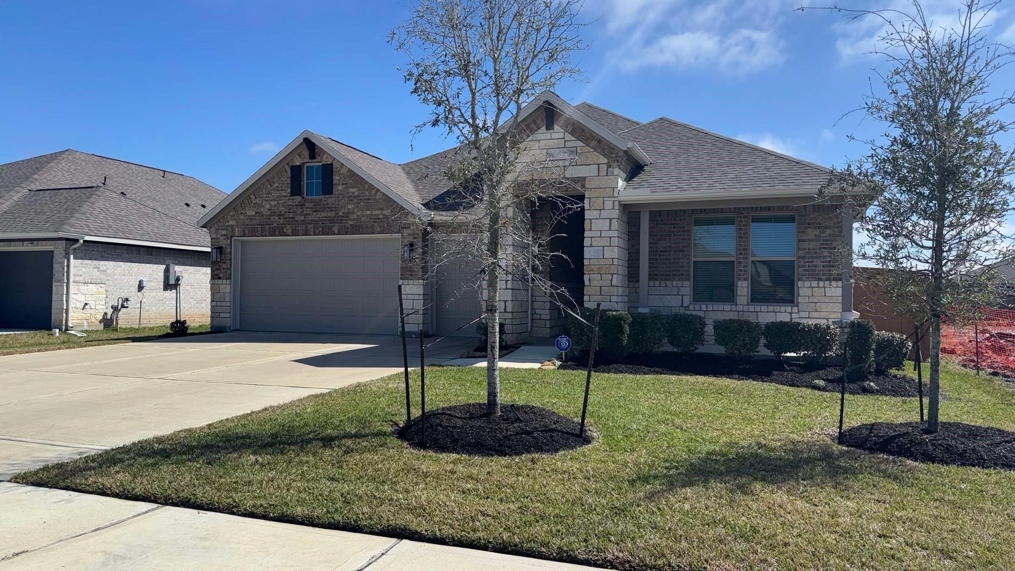 1818 Homewood Point Lane Rosharon, TX 77583 - Photo 2 of 41 a front view of a house with a yard