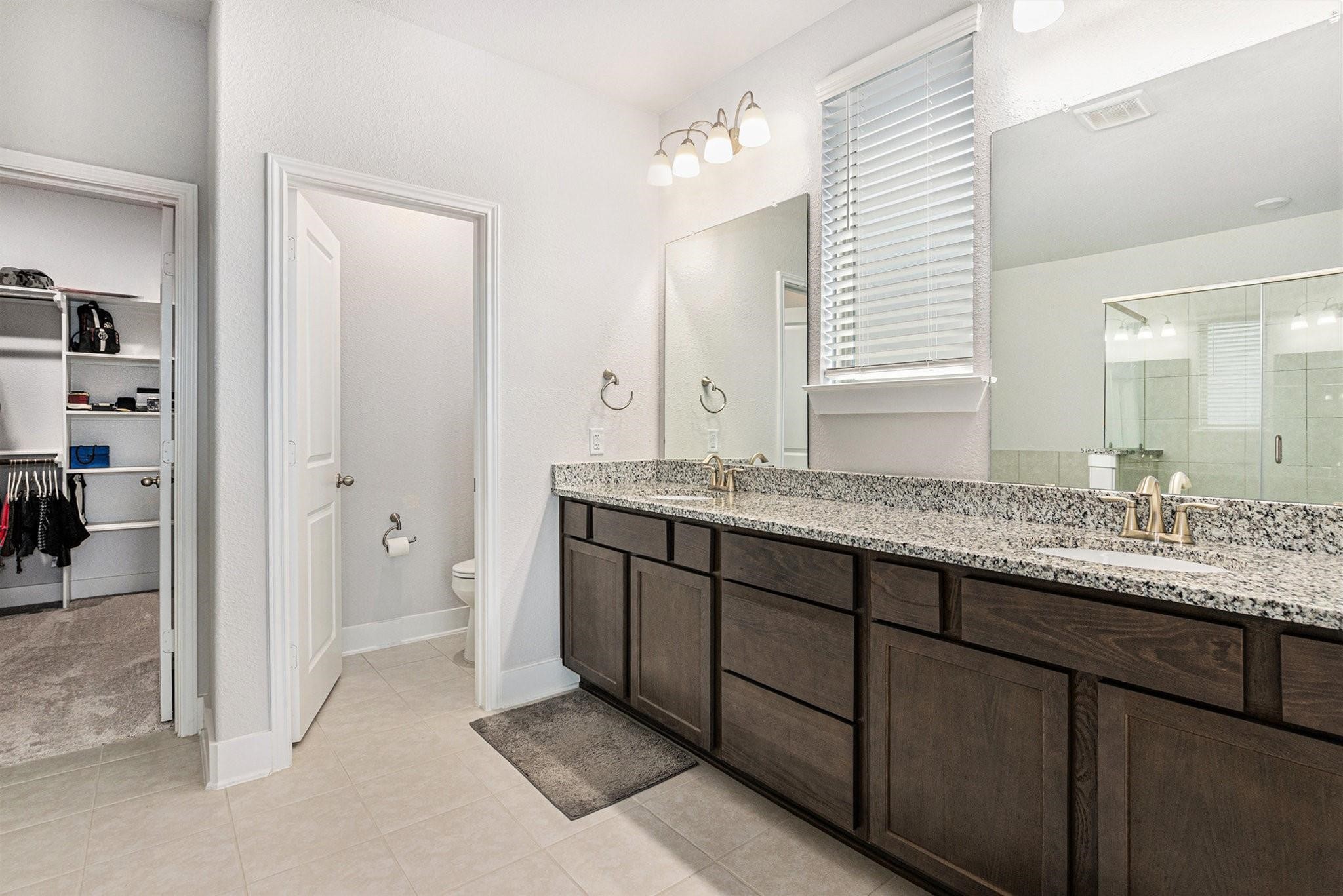 1818 Homewood Point Lane Rosharon, TX 77583 - Photo 21 of 41 a bathroom with a granite countertop sink and a mirror